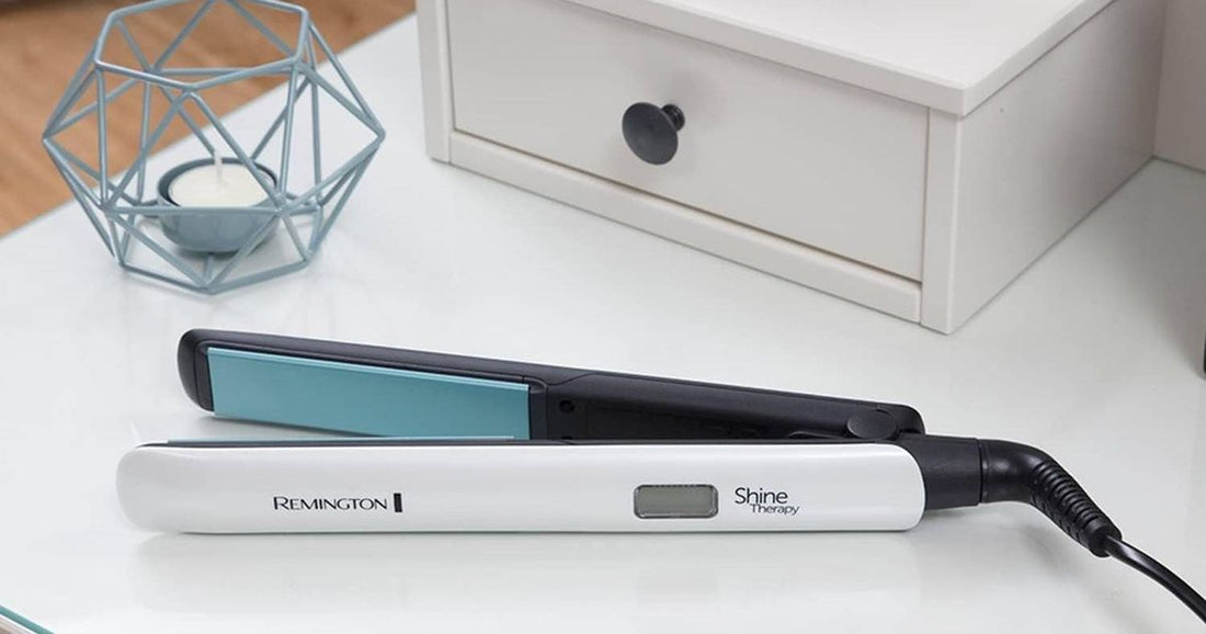 Close-up of ceramic-plate hair straighteners laid on a neutral surface during a sale period