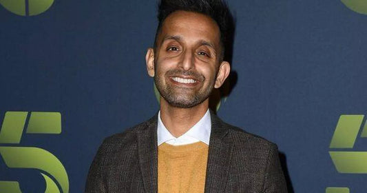 Dr Amir Khan posing on the red carpet at a Channel 5 photocall
