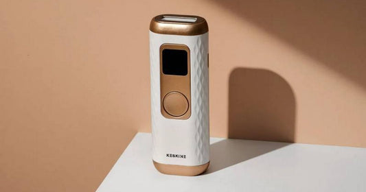 Close-up of an at-home IPL hair removal handset on a bathroom counter