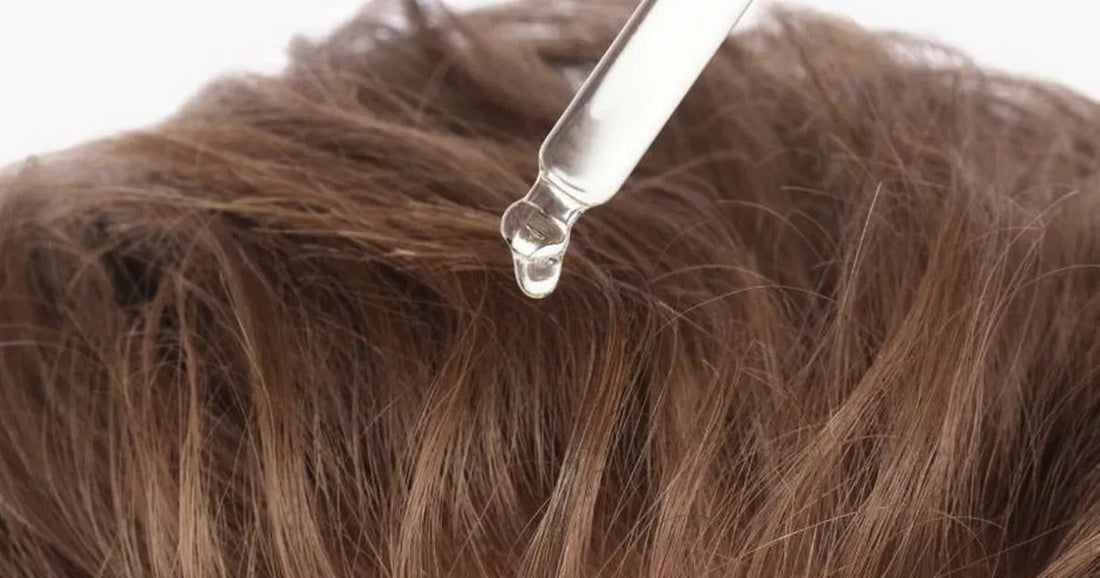 Hair thickening serum bottle shown in a product-style image