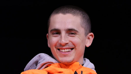 Timothée Chalamet with a freshly shaved head after cutting his signature curls