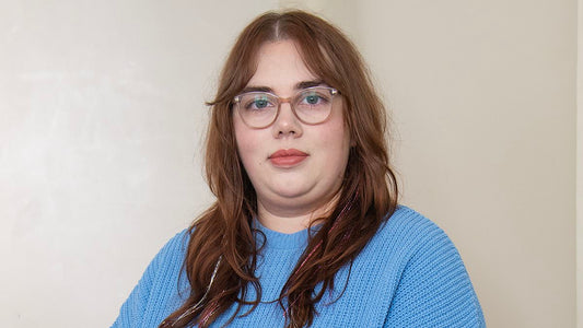 Woman looking concerned while reading about health symptoms