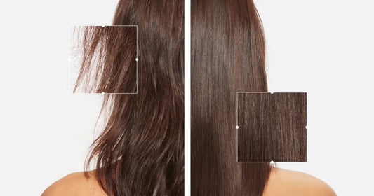 Close-up of a woman applying hair serum to her long, healthy hair