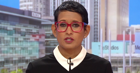 BBC Breakfast presenter Naga Munchetty with markedly longer dark hair in a candid street photo