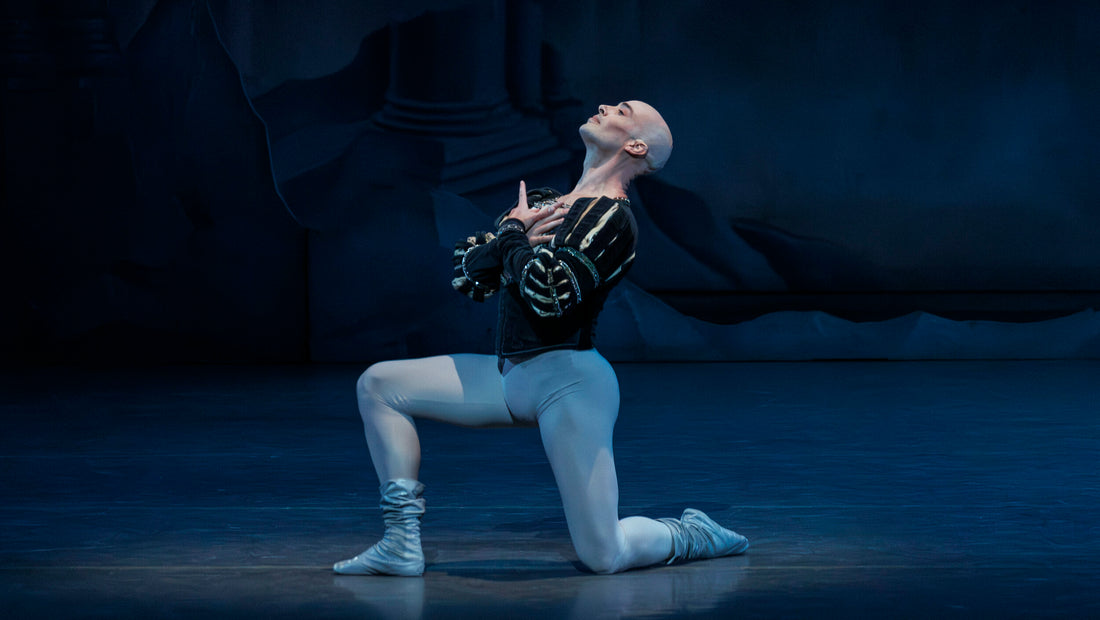 Male ballet dancers perform a classical pas de deux; discussion on embracing baldness onstage