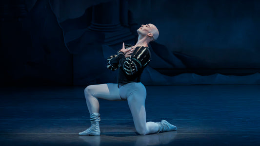Male ballet dancers perform a classical pas de deux; discussion on embracing baldness onstage