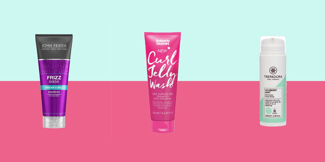 Woman with defined natural curls in soft light