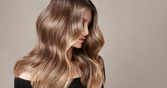 Woman with smooth, shiny hair after using anti-frizz hair serum