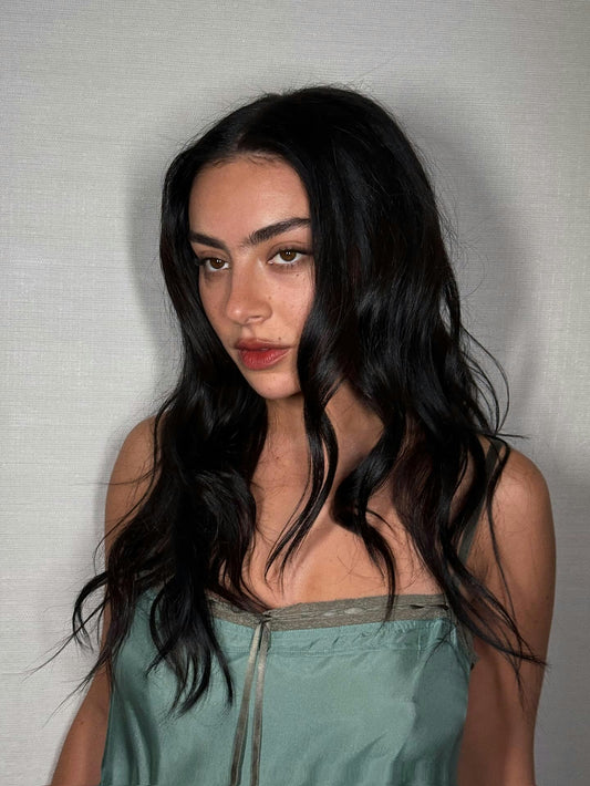 Model with glossy, high-shine single-tone hair colour under studio lighting