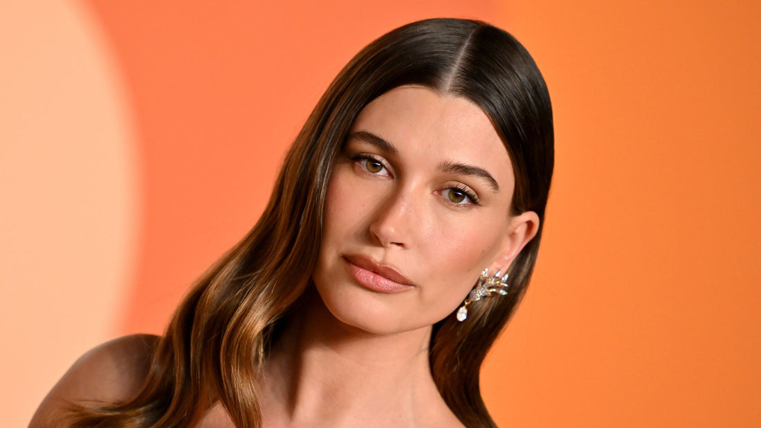 Hailey Bieber wearing soft, subtly styled winter hair at a cosy event