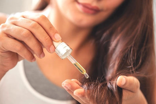 Close-up of glossy brunette hair with a light oil or silicone serum applied