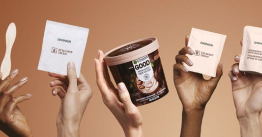 Garnier hair dye mask tube and colour swatches on white background