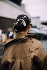 Brunette hair styled with French-inspired accessory for an effortless finish