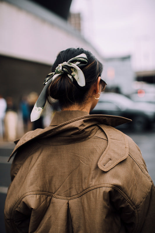 Brunette hair styled with French-inspired accessory for an effortless finish