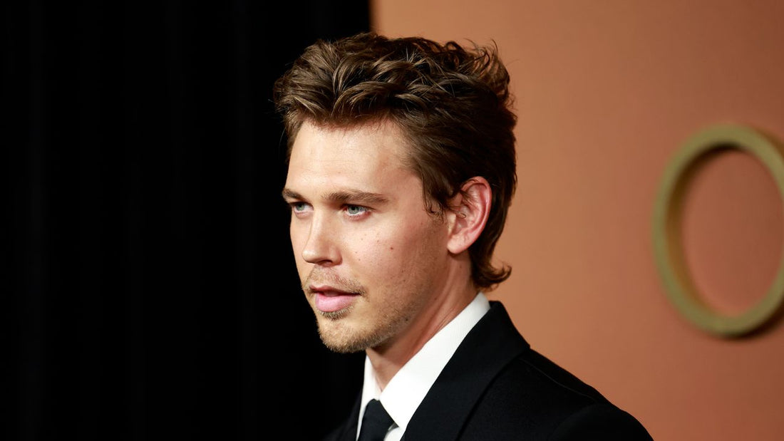 A man with a modern mullet hairstyle, neat at the front with longer textured back