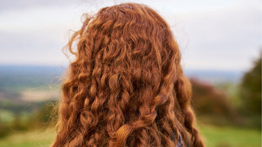 Close-up of vibrant red hair in natural light