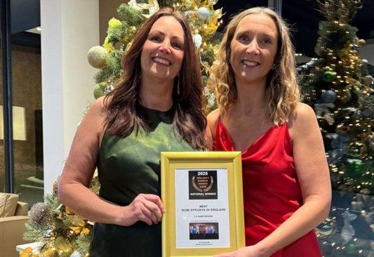 Inclusive UK hair salon interior with stylist and client