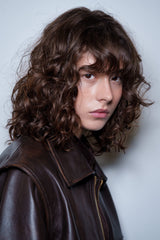 Model with sleek hair in a studio beauty shoot