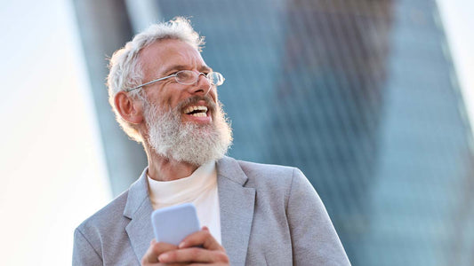A bearded man in smart workwear in an office setting