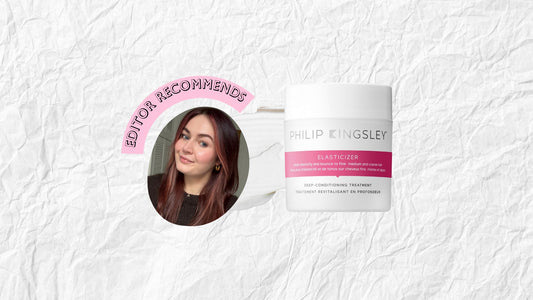 Open jar of creamy hair mask on a bathroom surface