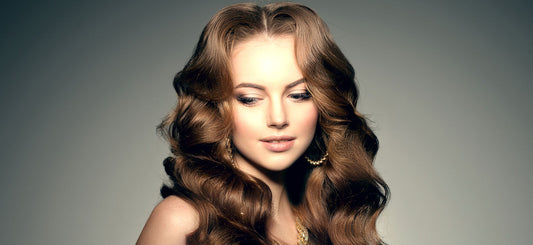 Model with long wavy hair showcasing clip-in extension texture