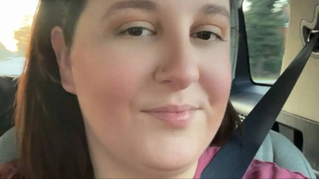 A woman with freshly cut hair looking upset in a salon setting