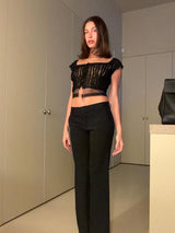 Model wearing a feathered bob haircut with softly flicked ends