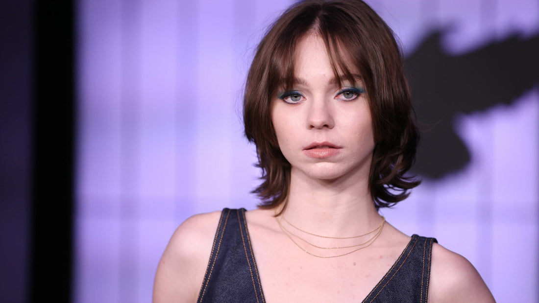 Model with a sleek chin-length varsity bob haircut wearing a winter coat