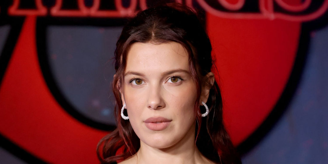 Millie Bobby Brown wearing a short, dark lob hairstyle