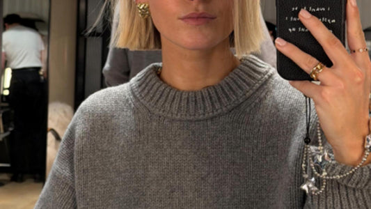A sleek, blunt bob haircut on a model with glossy finish