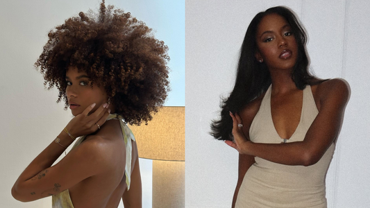 Close-up of hair straightener plates against curly hair